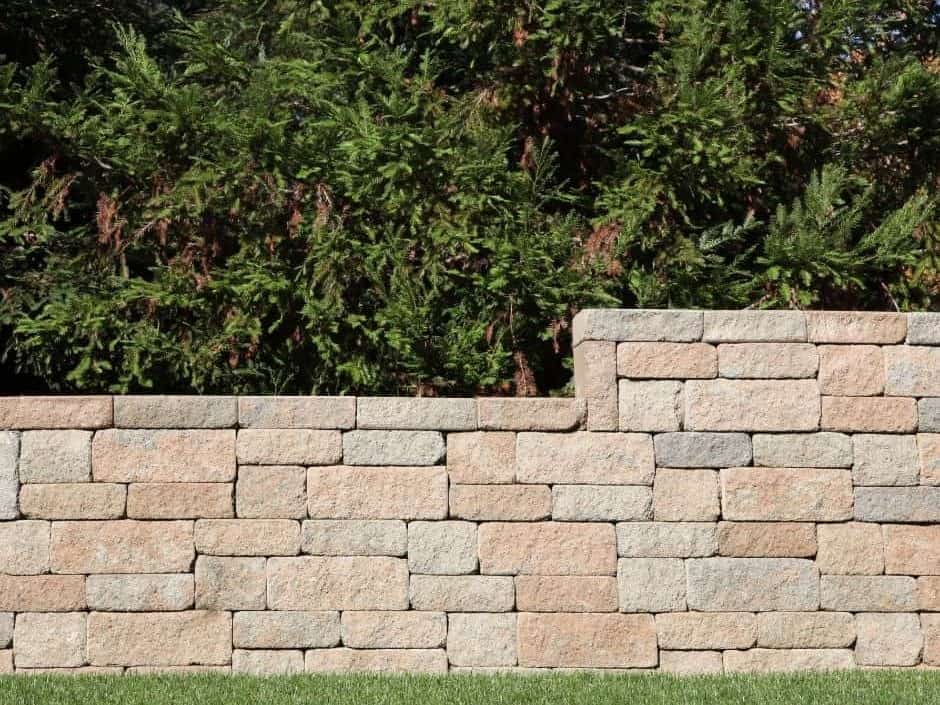 Stone paver wall with greenery background for landscape design.